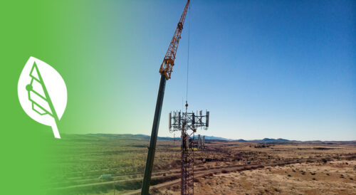 Technicians working on a telecommunications tower in a remote desert landscape, with a Bigleaf Networks logo on a green gradient background.
